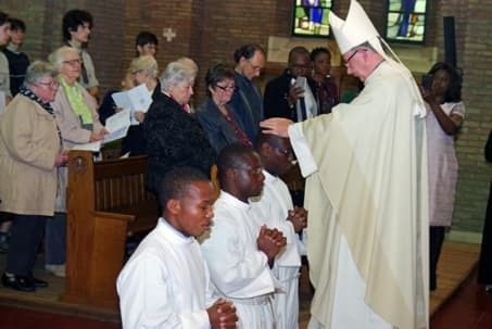 Diakenwijding van Laurent Kliba, Jean Paul Diby en Brice Akagbo in 2019 door bisschop Koen Vanhoutte in Leuven