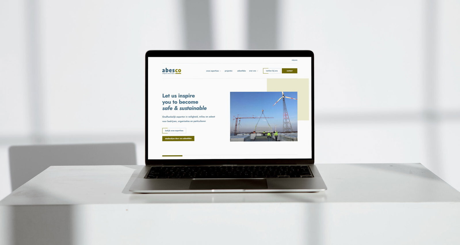 The ABESCO website on a laptop