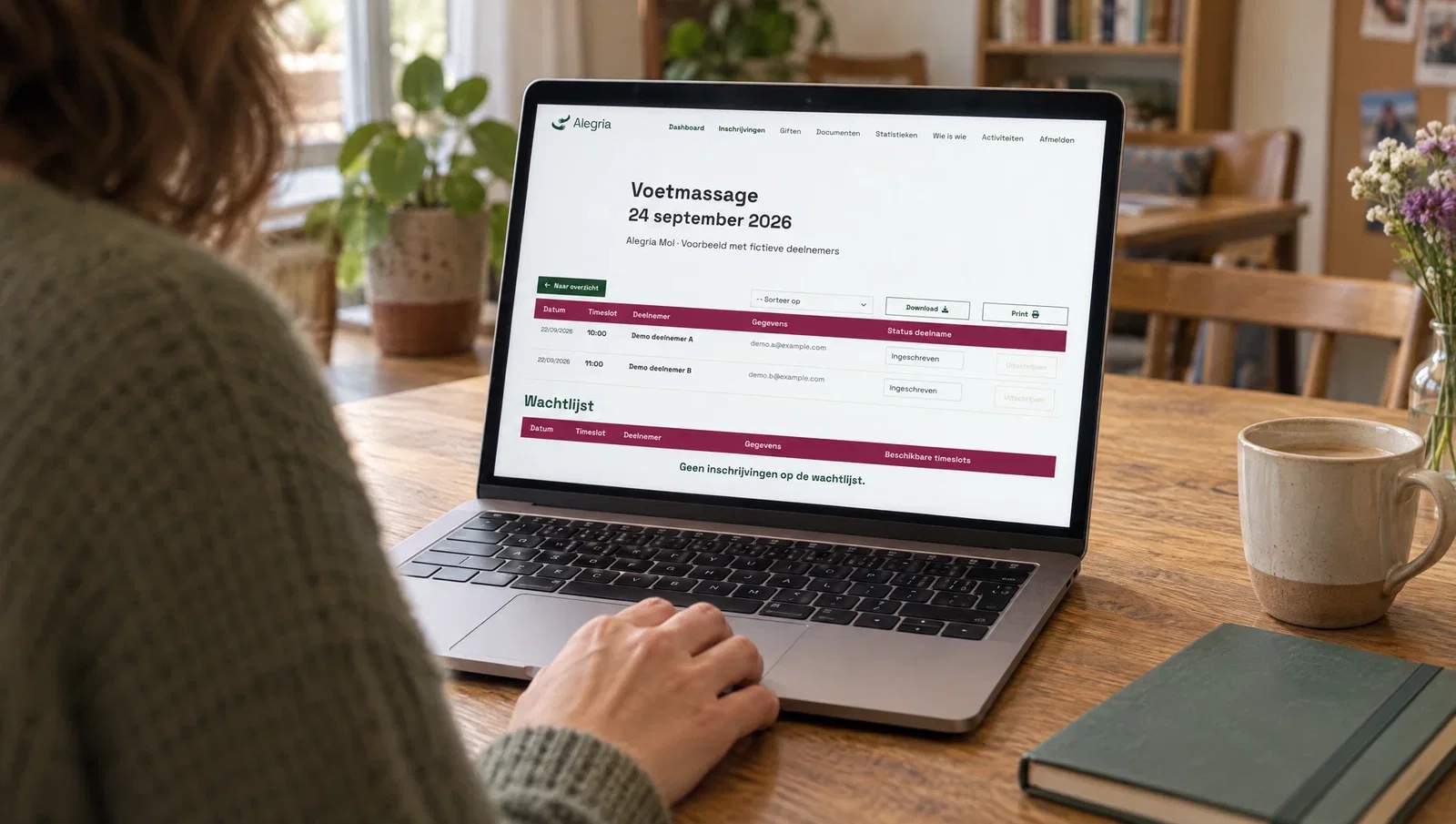 Alegria’s registration overview on a laptop, showing only fictitious participants and contact details.