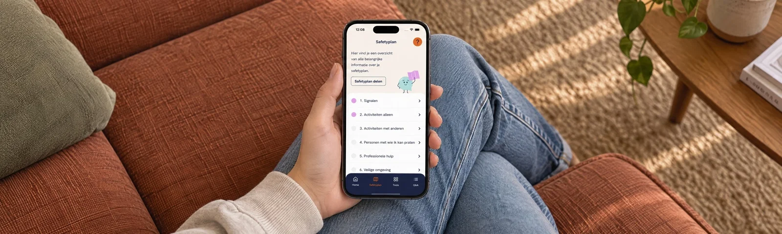 A young person holds a smartphone showing the Spark* Safety Plan.